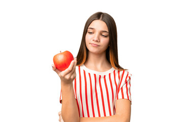 Teenager girl with an apple over isolated chroma key background with sad expression