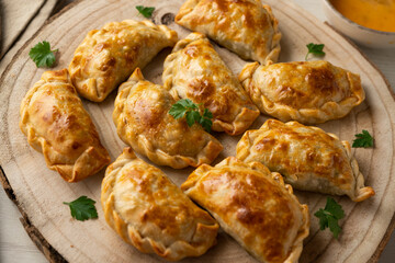Baking delicious Argentine empanadas with chicken and vegetables.
