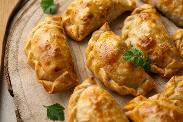 Baking delicious Argentine empanadas with chicken and vegetables.
