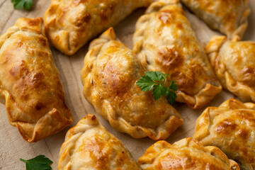 Baking delicious Argentine empanadas with chicken and vegetables.
