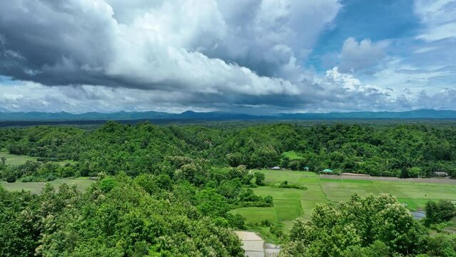 Beauty of hill tracts and lush green landscapes captured from above in this mesmerizing drone video. Immerse yourself in the serene tranquility of remote wilderness and majestic mountain scenery.