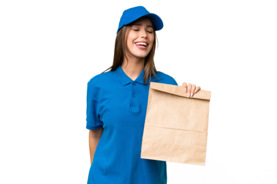 Young beautiful caucasian woman taking a bag of takeaway food over isolated background laughing