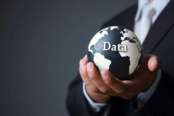 businessman hold globe with word “Data” represents information technology that is connected in the online world