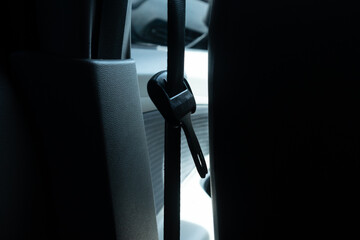 A view of a car seat belt or safety belt. Unfastened seat belt.