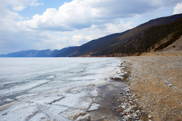 Lake Baikal in spring. Ice floes in the lake, the time of ice melting.