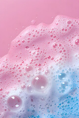 Background with foam made of soap, shampoo, lotion, detergent in blue and pink colour. Macro photo of bubbles in water. Banner for laundry and cleaning services, spa, beauty and skin care concept.