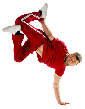 Dynamic portrait. Young sportive man performing dance, hip-hop, breakdance elements in motion against transparent background. Concept of urban, youth culture, active lifestyle. Copy space.