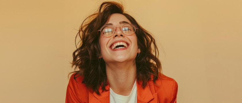 Exuberant woman laughing with joy, her vivacity and spontaneous happiness conveying a sense of freedom and light-heartedness