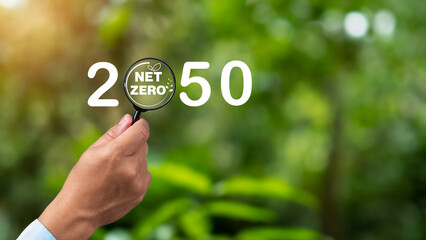 Net zero icon inside magnifier glass, Net zero greenhouse gas emissions target, Carbon neutral and...