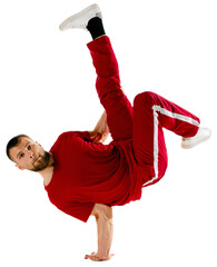 Stylishly dressed man performing freestyle, breakdance, standing on hands and legs raised up...