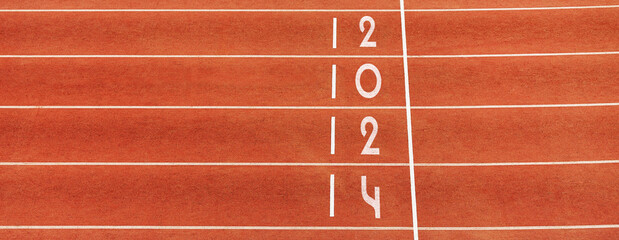 “2024” in white on finish line red track running, symbolizing summer sports games