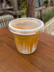 Dirty coffee cup or espresso coffee with milk