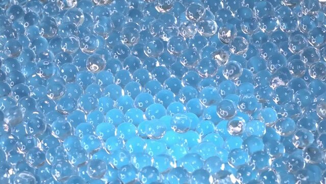 A macro universe of hydrogel beads, their translucent forms gleaming with reflected light, presenting a vision of modern decoration or scientific application.