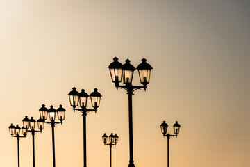 Lamps in setting sun. - 734021572