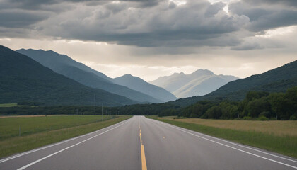 Desolate road framed by distant mountains