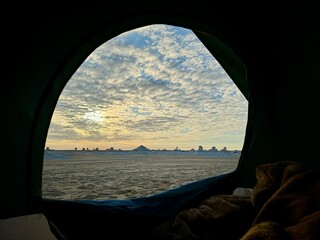 view from the tent at sunrise in the desert 