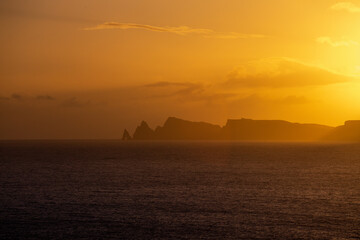 Characteristic Ilhéu da Pocariça, cliffs at the sunrise from distance - Madeira, Portugal