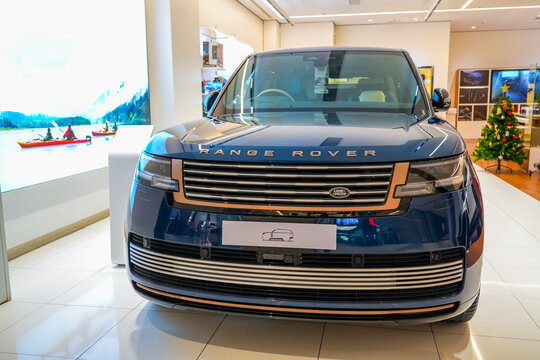 Land Range Rover blue in the showroom on the shop showcase exhibition of an official dealer. Thailand, Bangkok 21 december 2023