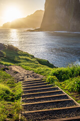 Stairway to the ocean on Guindaste viewpoint at the sunrise - Madeira, Portugal 