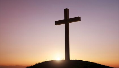 image of the cross of Jesus Christ on a hill against a sunset background