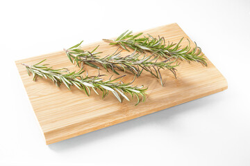 Fresh rosemary sprigs on white, aromatic herb for cooking, spice for dishes.