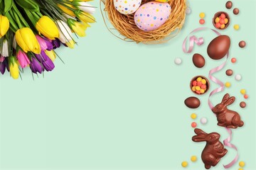 Happy Easter card with colored easter eggs on desk