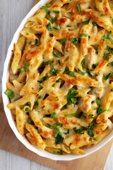 Homemade Cheesy Chicken Alfredo Pasta Bake in a Dish, top view.