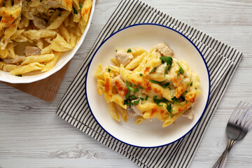 Homemade Cheesy Chicken Alfredo Pasta Bake on a Plate, top view.