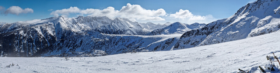 Majestic balkan mountains panorama. Rocky peaks covered with snow in Bulgaria