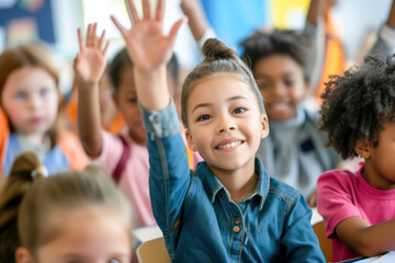 Students raising their hands in class at the elementary school