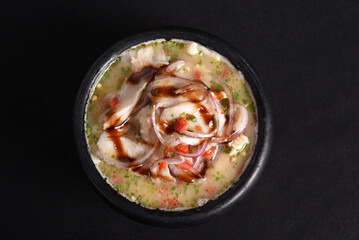 ceviche raw fish food with lemon onion pepper and lemon, healthy food