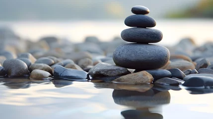 Fototapeten Zen Stones in Harmony on Pebbled Beach at Sunset Reflection Water Balance Concept © John