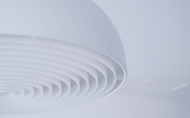 white ceiling lamp with a circular pattern
