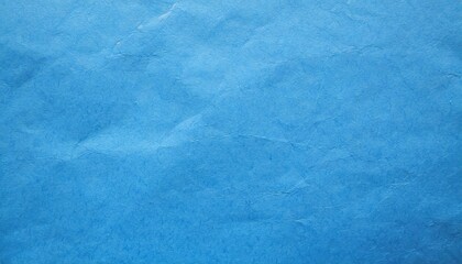 Bright blue crumbled paper texture background.