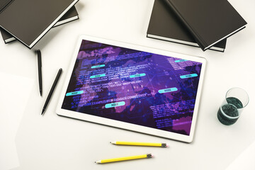 Modern digital tablet monitor with abstract programming language and world map, research and development concept. Top view. 3D Rendering