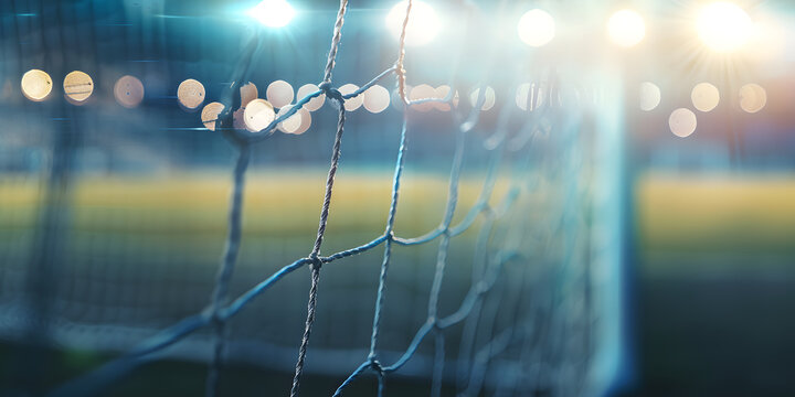 Fu&szlig;balltor-Fokus: Verschwommener Hintergrund mit Bokeh-Effekt und Netz im Vordergrund