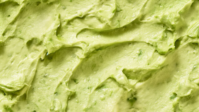 Guacamole sauce texture closeup. Mexican food. Guacamole. A seamless food texture. Use this texture in fabric and material printing, image backgrounds, posters and menus, invitations, collage