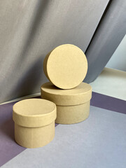 ecological kraft boxes of different sizes on colored paper