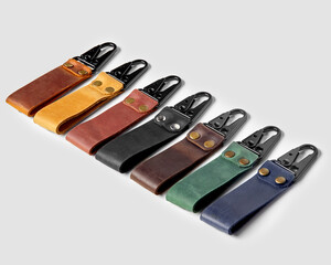 Handcrafted embossed leather keychains of various colors with carabiner clasps