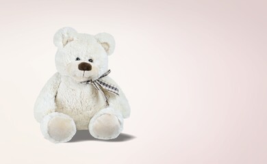 Stuffed cute soft toy on background