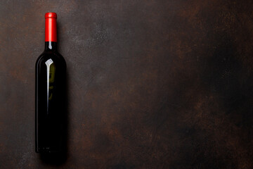 Red wine allure: Bottle on rustic stone