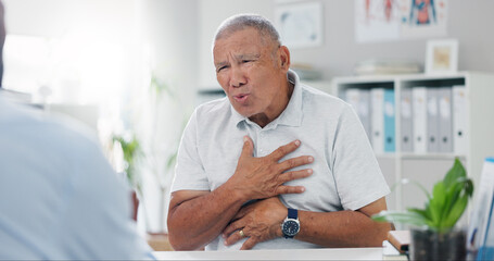 Senior, man and consulting doctor on chest pain, sore or discomfort in healthcare hospital. Mature,...