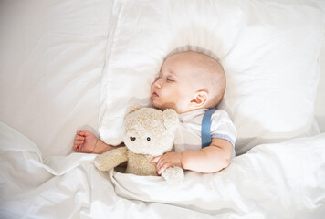 Child's Defenseless Sleep Toddler Sleeping Boy Hugging Teddy Bear Sleeping Toy On White Bed
