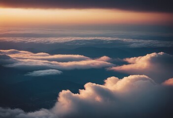 Obraz premium The view from the airplane window to the clouds and sunset. Airplane wing above thick pink and orange clouds. Wonderful breathtaking view.