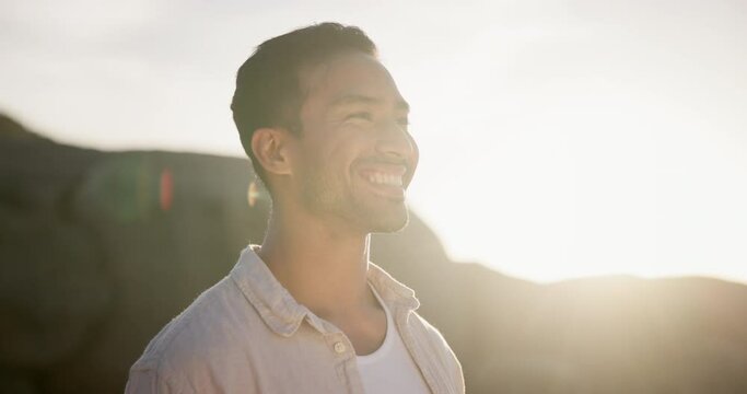 Beach, sunset and man with peace, breathing and relax on holiday or vacation in sunshine. Calm, person and enjoy fresh air outdoor in summer, nature and travel to ocean in California for break
