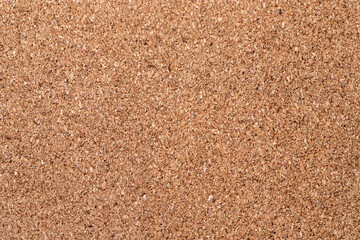 Brown textured cork close up. Suitable for use as a background texture.