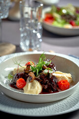 Stewed veal cheeks with mashed potatoes and vegetables