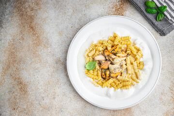 fusilli pasta with mussels seafood Mediterranean cuisine tasty fresh eating cooking appetizer meal food snack on the table copy space food background rustic top view