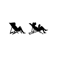 People sitting on a deck chair beach, tourists, island, travel, palm trees, relaxation. Silhouette people sitting on the beach. People are reading books. People enjoy summer.