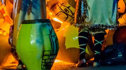 Candombe drummers tempering drums close up